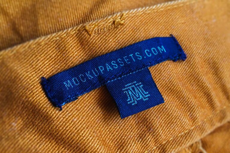 Blue Canvas Label Logo Mockup on Yellow Jeans - Mockup Assets Text & Symbol