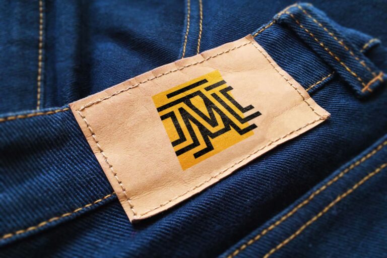 Yellow-Paper-Label-Logo-Mockup-on-Dark-Blue-Jeans-Symbol-Feat-IMG