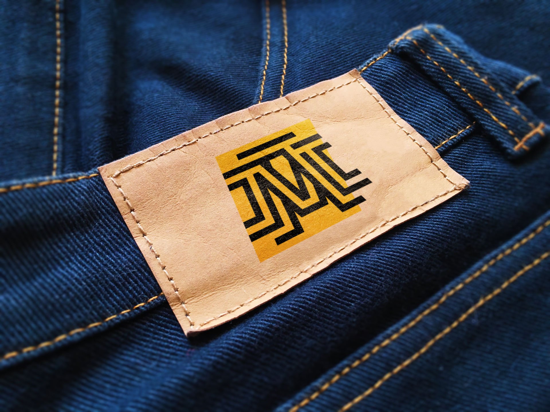 Yellow Paper Label Logo Mockup on Dark Blue Jeans Symbol